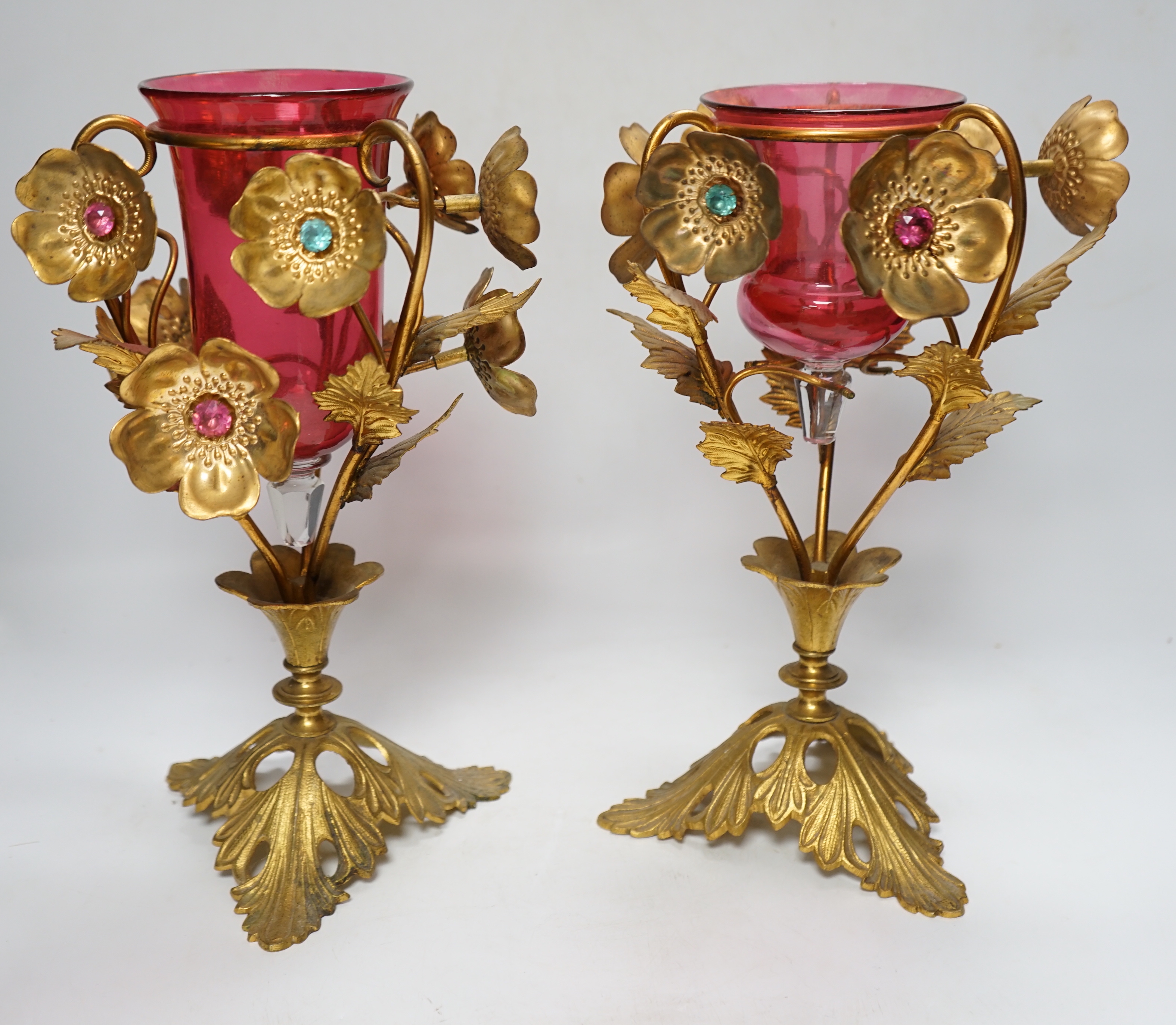 A near pair of early 20th century cranberry glass and gilt metal ornate vases, 31cm